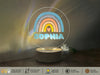 a glass sign with a rainbow and the word sophiia on it