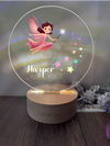 a glass ball with a picture of a fairy on it