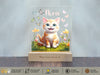 a picture of a cat on a wooden stand