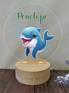 a wooden stand with a picture of a dolphin on it