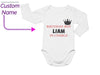 a baby bodysuit with a crown on it