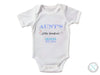 a white onesuit with the name of an infant