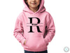 a young boy wearing a pink hoodie with the letter r on it