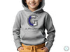 a young boy wearing a grey hoodie with the letter g on it