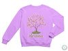 a purple sweatshirt with a tree and name on it