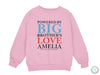 a pink sweatshirt with the words, powered by big brother&#39;s love ameli