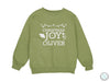 a green sweatshirt with the words christmas joy on it