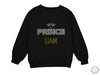 a black sweatshirt with the words prince and a crown on it